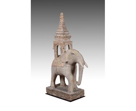 Modelled standing, with a caparisoned howdah on its back, rectangular base, its details picked out in ochre and natural pigme