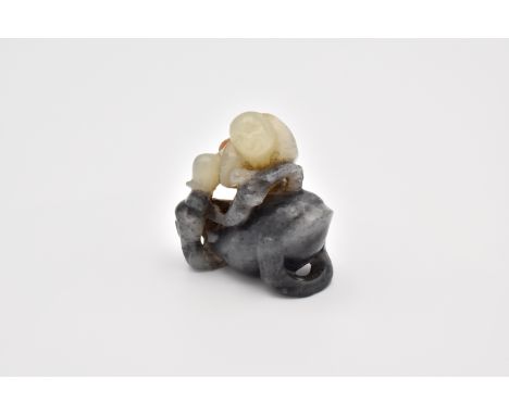 Skilfully carved using the russet outer skin of the pebble for a string of coins Liu Hai carries over his shoulder, the toad 