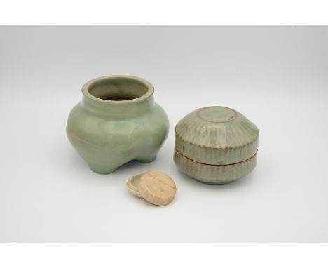 The tripod vessel covered in a sea-green glaze, the feet and rim reduced exposing the grey stoneware body, drilled ownership 