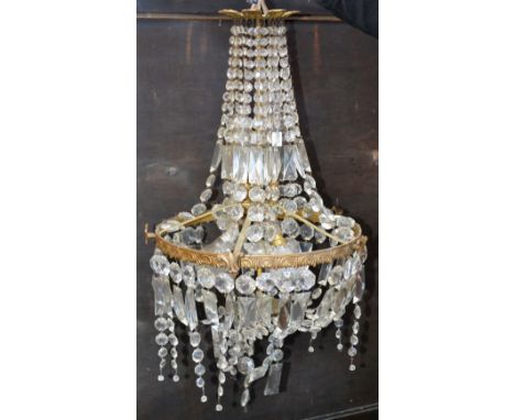 A bag shaped chandelier with faceted glass graduated drops