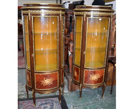 A pair of Louis XV Revival gilt metal mounted Kingwood and  marquetry bowfront vitrines, moulded caddy top above a three-quar