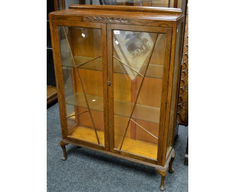 An Edwardian oak Art Deco two door display cabinet