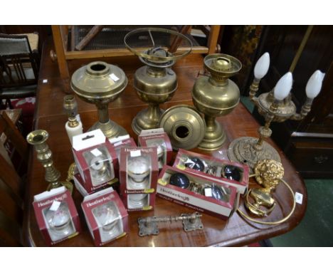 A Duplex brass oil lamp; others similar; Heatherley ceramic door knobs, boxed; a brass door knocker, etc