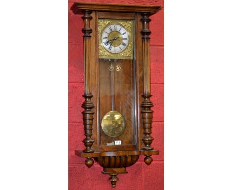 A 19th century Vienna wall clock, silvered chapter ring, Roman numerals, brass spandrels, mahogany case, twin weight manual m