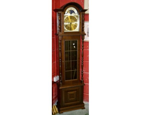 A modern reproduction oak longcase clock, FHS 451-050H movement, arched face, sun and moon dial, Roman numerals, glazed door 