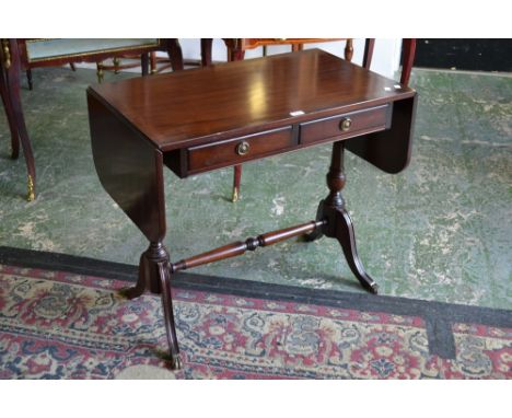 A Strongbow Furniture Regency reproduction mahogany sofa table, crossbanded top, two short drawers to frieze, turned end supp