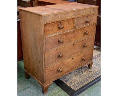A George III oak chest, caddy top, two short cockbeaded drawers over three graduated long, turned handles, inlaid ebony kite 