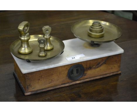 A set of Victorian mahogany and marble top scales, Maw and Co., London; two sets of brass weights