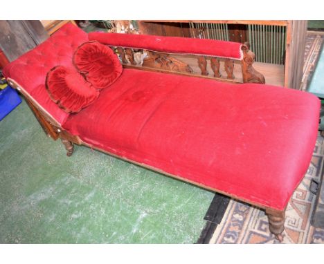 A Victorian mahogany chaise, button upholstered scrolling arm, padded toprail to pierced and carved back, stuffed over seat, 