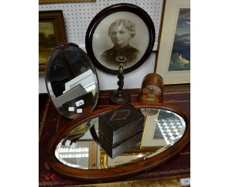 An early 20th century treen musical box, as a barrel, reg.no.729418; a bevelled oval dressing table mirror; a portrait; a tre