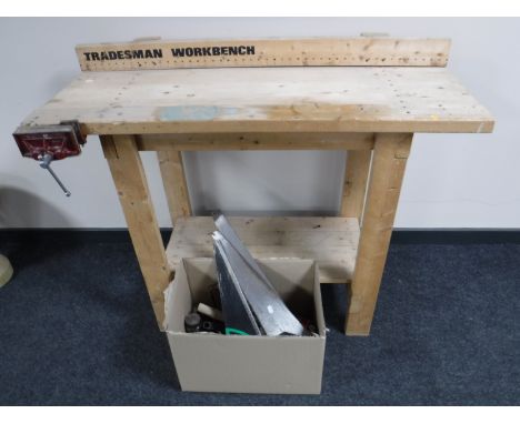 A Tradesman work bench with vice and a box of hand tools 