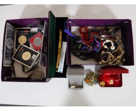 Two boxes containing assorted coins including Royal Mint World Savers coins, crowns , etc, together with a boxed ladies rotar