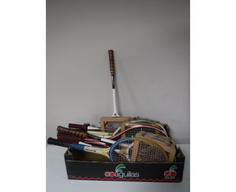 A box of tennis rackets, walking stick, shooting stick 