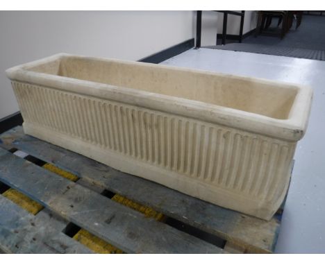 A composition garden trough 