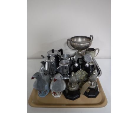 A tray of four piece Swan chrome tea service on tray, pigeon racing trophies and two pottery pigeons 