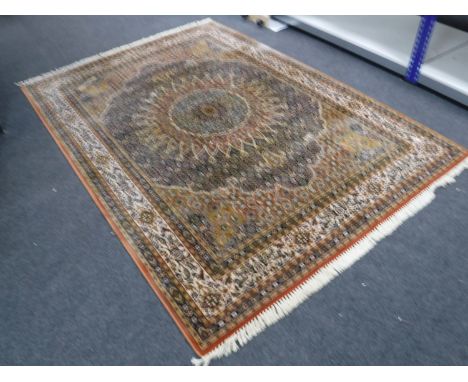 A machine made carpet of Tabriz design, 293cm by 197cm