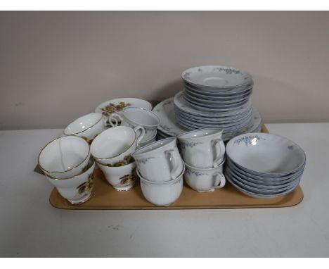 A tray containing a West German tea and dinner service, together with six Crown Trent bone china trios  