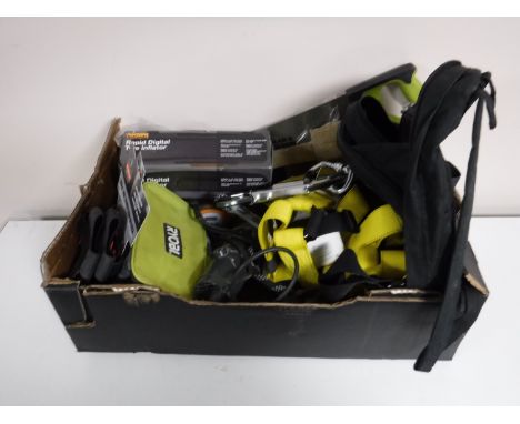 A box containing power tools, tire inflator, hand saw, harness strap, rucksack, etc 