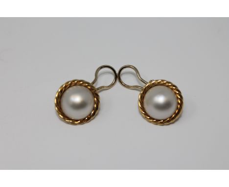 A pair of 18ct gold mabe pearl earrings