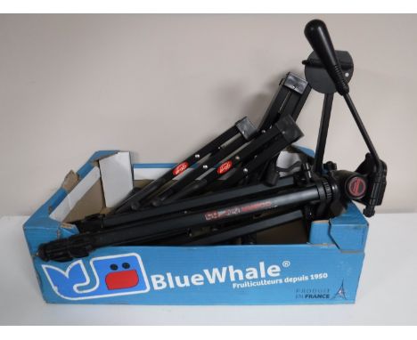 A box containing a camera tripod together with four folding guitar stands by Q-EX and Stagg 