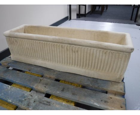 A composition garden trough 