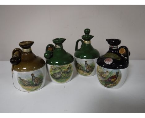 Four Rutherfords Scotch Whisky decanters, two sealed 