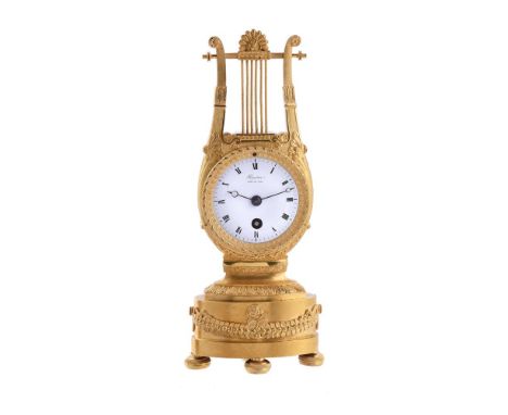 A FRENCH EMPIRE SMALL ORMOLU LYRE-SHAPED MANTEL TIMEPIECERIEUSSEC, PARIS, EARLY 19th CENTURY The circular eight-day single tr