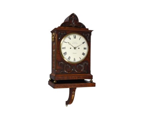 A WILLIAM IV CARVED AND BRASS INLAID MAHOGANY BRACKET CLOCK WITH WALL BRACKETTURNER, LONDON, CIRCA 1830The five pillar twin f