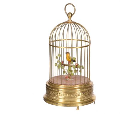 A SWISS SINGING CAGED BIRD AUTOMATONUNSIGNED, MID 20th CENTURYThe bird yellow plumage set on a cruciform perch decorated with