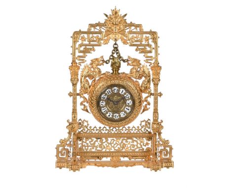 A FRENCH GILT BRASS 'JAPONESQUE' MANTEL TIMEPIECETHE MOVEMENT STAMPED FOR VICTOR ATHANASE-PIERRET, CIRCA 1880The circular sin