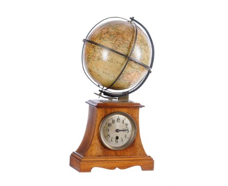 A GERMAN WALNUT TERRESTRIAL GLOBE MANTEL TIMEPIECEUNSIGNED, CIRCA 1900The circular movement with skeletonised plates and leve