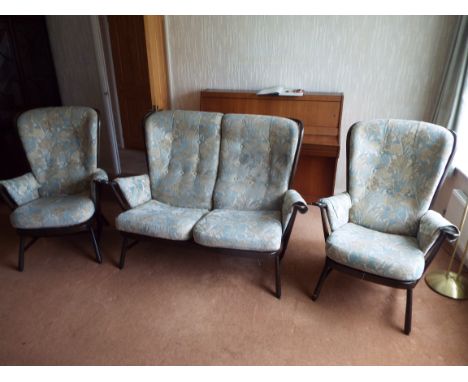 An Ercol three piece suite comprising a two seater settee and two armchairs.

NOTE: ITEM IS LOCATED IN THE CH66 POSTCODE AREA