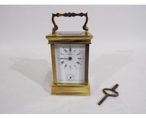 Boodle &amp; Dunthorne - A French gilt brass and glass carriage alarm timepiece retailed by Boodle &amp; Dunthorne, the Engli