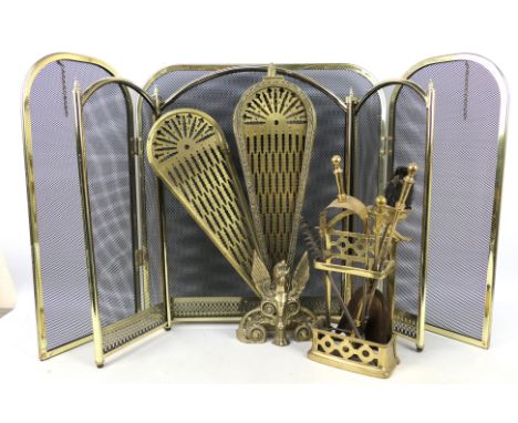 Three fire guards including a brass Peacock example and a brass fireside companion set.

Condition Report: Peacock screen is 