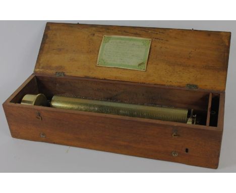 A 19thC Swiss musical cylinder, no.6108 and playing eight airs, removed from original box and placed in a mahogany replacemen