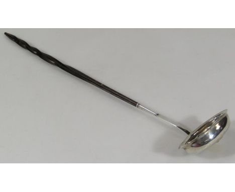 A George III silver toddy ladle, with partially turned whale bone handle and plain oval bowl, London, probably 1800, 37cm hig
