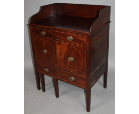 A Georgian mahogany night chest, with a three part galleried top above a frieze drawer and double cupboards and two further d