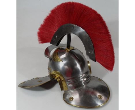 A modern Roman style helmet, with red sash style top, 45cm high. 