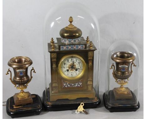 A 19thC brass and enamel aesthetic style clock garniture, comprising mantel clock and two urns, the clock with 11cm diameter 