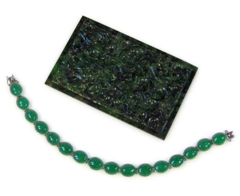 A 20thC Chinese spinach jade plaque, of rectangular part pierced outline raised with flowers and a jade style bracelet, 18cm 