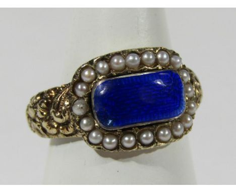 A George IV memorial ring, with blue enamel head surrounded by seed pearls, the reverse engraved 'Wm. Wilson Esq. Oct. 1821 a