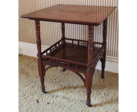 A late Victorian walnut window table, with upturned uprights and galleried undershelf on brass and ceramic castors, 56cm squa