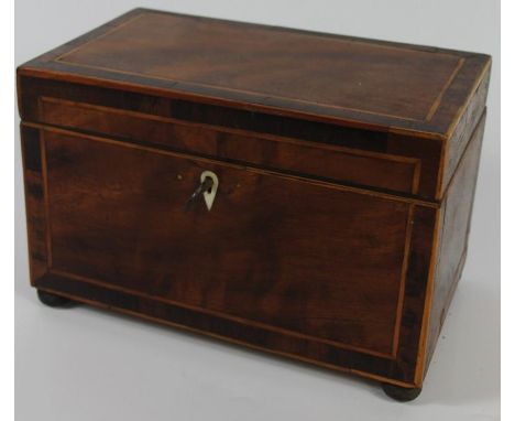 A George III flame mahogany three sectional tea caddy, with rosewood banding and ball feet