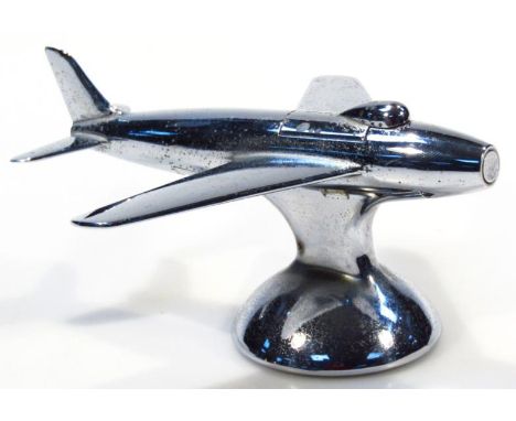 A 1950's Dunhill lighter, formed as a Sabre F-80 fighter plane, chrome plated on a baize lined base with articulated top, mar