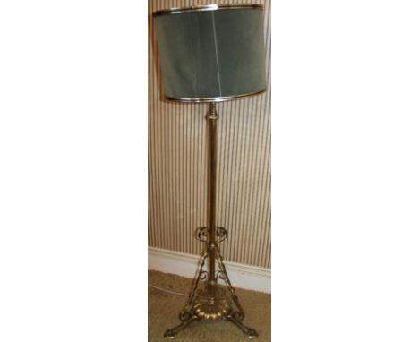 An early 20thC brass oil lamp standard, converted for electricity