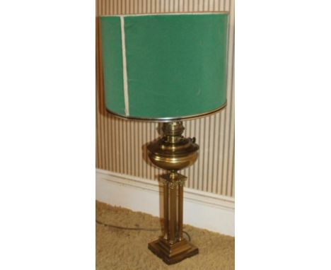 A brass Corinthian columnar table lamp