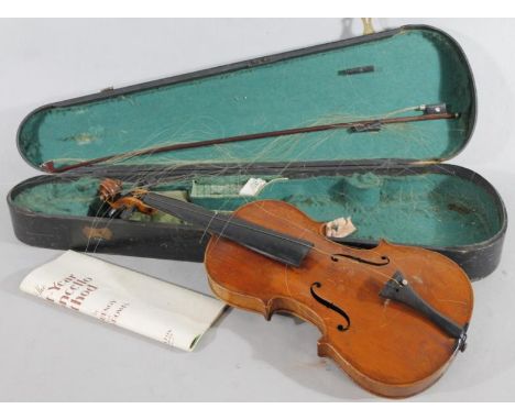 An early 20thC two piece violin, with pine carcass and ebonised articulated knops, 60cm wide, with mother of pearl ended rose