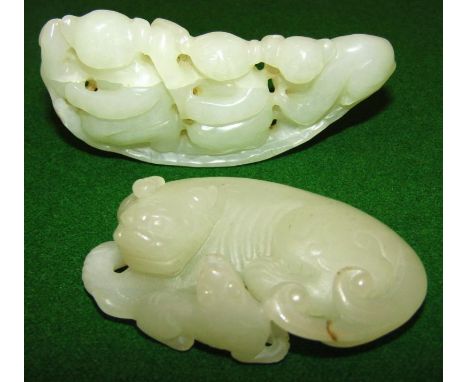 Two Chinese jade figures, comprising a partially carved group of graduated Hotei and a recumbent animal aside bird, 7cm wide.