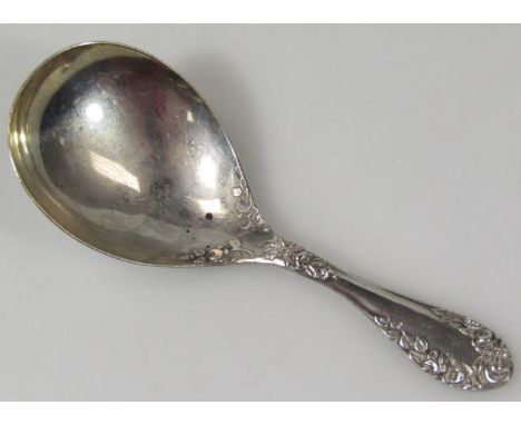 A George VI silver caddy spoon, the handle with shaped floral outline with plain bowl, Birmingham 1939, 9cm wide.