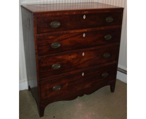 A George III flamed mahogany chest, of four graduated drawers with crossbanded top, oval brass backplate handles, Cupid's bow